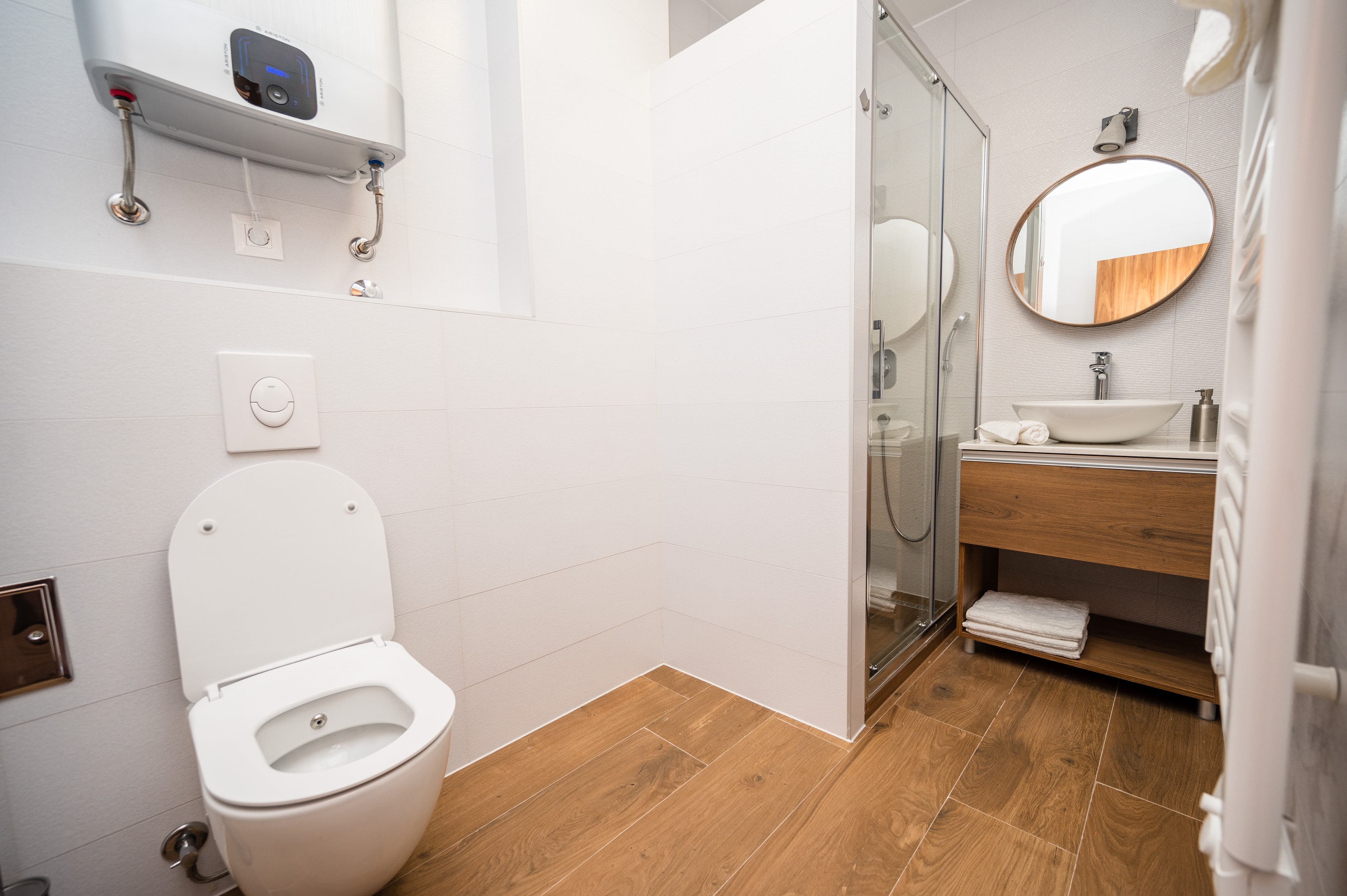 Our spacious bathroom comes with a walk-in shower, fresh towels and toiletries for you!