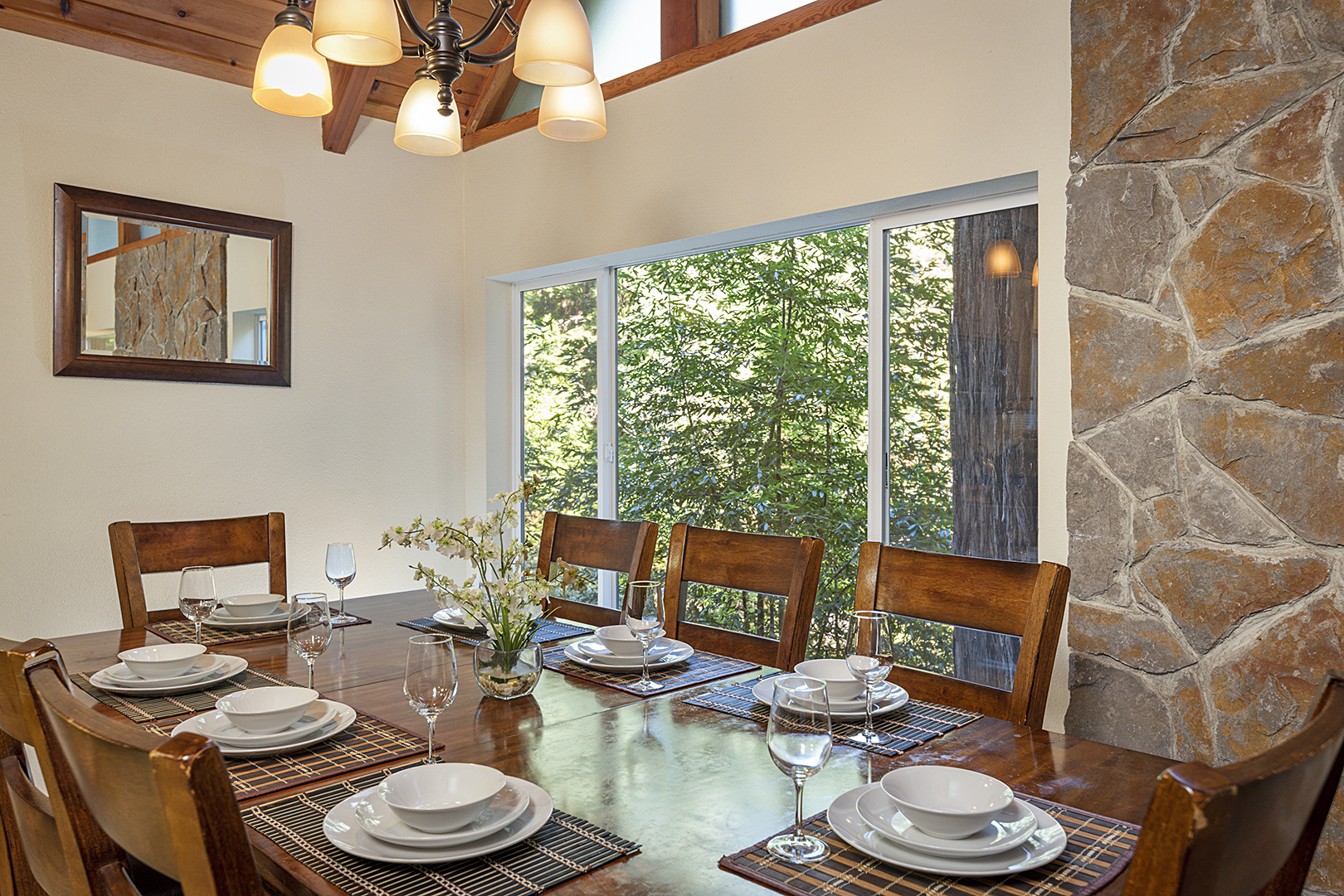 Room for 8 and creekfront views at the dining table.
