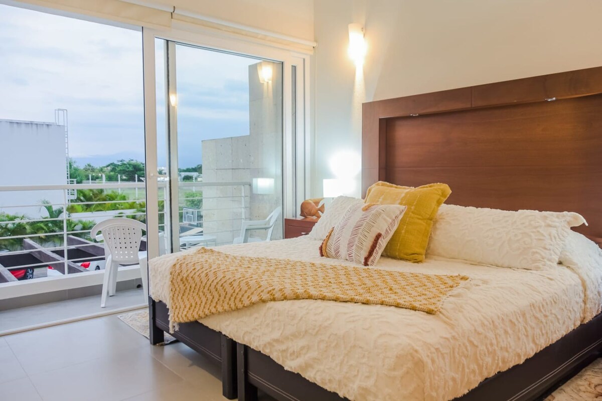 Principal Bedroom - King Bed with TV, Balcony, & Ensuite Bathroom